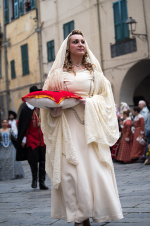 Taggia, Italy - February 26, 2017: Participant of medieval costume party in the historic city of Taggia in Liguria region of Italy. The actors acting out episodes of daily life in settings that evoke moments of life lived fully the seventeenth century. Thのeditorial素材