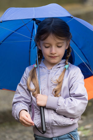 Girl with an umbrella in the rain