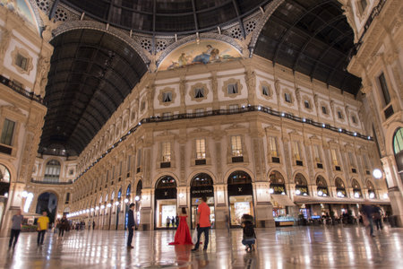 Milan, Italy - May 15, 2017: Low angle view of Vittorio Emanuele gallery - is an historic shopping arcade situated in the center of Milanのeditorial素材