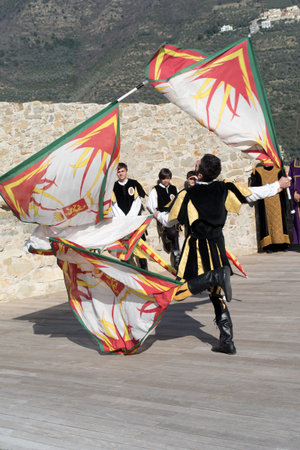 Taggia, Italy - February 25, 2017: Flag throwing during medieval festival in the historic city of Taggia in Liguria region of Italyのeditorial素材