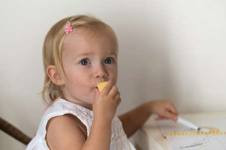 Caucasian little girl playing at home, close upの写真素材