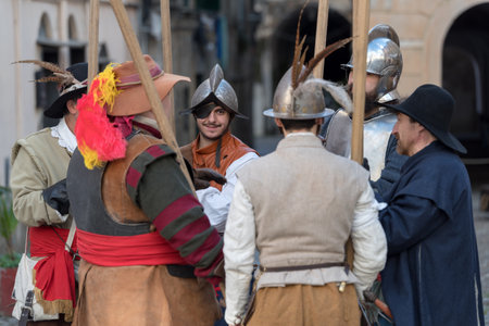 Taggia, Italy - March 17, 2018: Participants of medieval costume party in the historic city of Taggia in Liguria region of Italy. The actors acting out episodes of daily life in settings that evoke moments of life lived fully the seventeenth century. The のeditorial素材