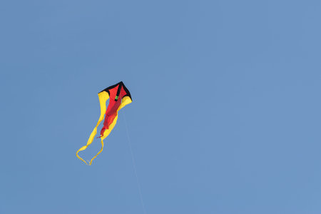 Low angle view of kite flying against clear sky