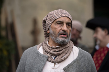 Taggia, Italy - March 18, 2018: Participant of medieval costume party in the historic city of Taggia...