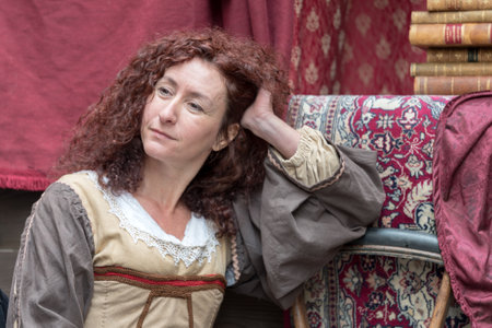 Taggia, Italy - March 18, 2018: Participant of medieval costume party in the historic city of Taggia in Liguria region of Italy. The actors acting out episodes of daily life in settings that evoke moments of life lived fully the seventeenth century. The eのeditorial素材