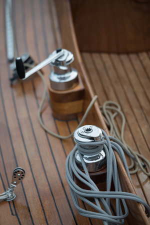 Nautical details on boat deck with ropes and marine tools