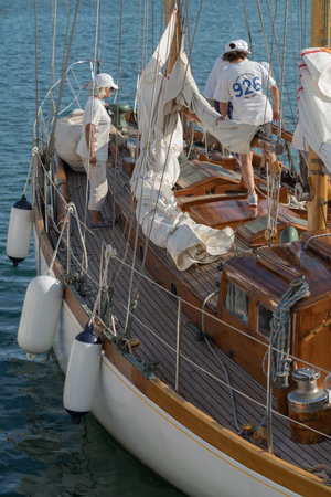 Imperia, Italy - September 7, 2018: Crew members on sailboat moored in the harbour of Imperia during stage of the Classic Yachts Challenge. Stage of the Panerai Classic Yachts Challenge, is a key event in sailing the Mediterranean. Over 60 boats representのeditorial素材