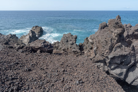 Sea and volcanic lava rocks at the Los Hervideros west coast of Lanzarote island, Spain