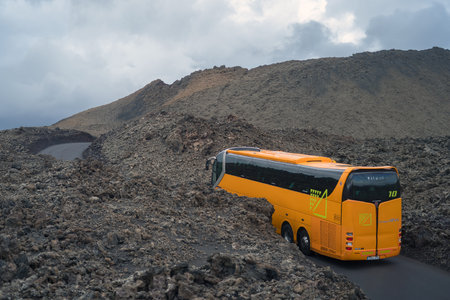 Lanzarote, Spain - October 23, 2018: Tour bus in the National park Timanfaya, Lanzarote Island, Canary Islandsのeditorial素材