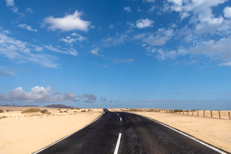 Spain, Fuerteventura, Corralejo Natural Park, view of empty road