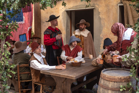 Taggia, Italy - February 24, 2019: Participants of historical reenactment in the old town of Taggia, in Liguria region of Italy. The actors acting out episodes of daily life in settings that evoke moments of life lived fully the seventeenth century. The eのeditorial素材