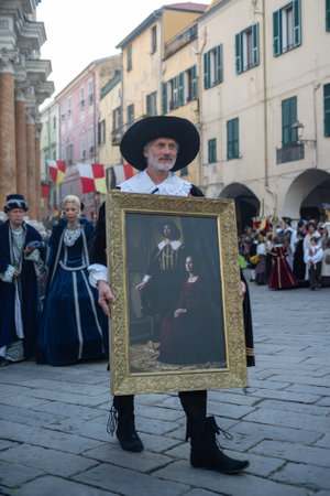 Taggia, Italy - February 24, 2019: Participant of historical reenactment in the old town of Taggia, in Liguria region of Italy. The actors acting out episodes of daily life in settings that evoke moments of life lived fully the seventeenth century. The epのeditorial素材