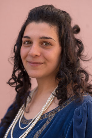 Taggia, Italy - February 24, 2019: Portrait of participant of historical reenactment in the old town of Taggia, in Liguria region of Italy. The actors acting out episodes of daily life in settings that evoke moments of life lived fully the seventeenth cenのeditorial素材