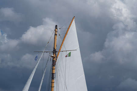 Sail of a boat against of cloudy skyの写真素材