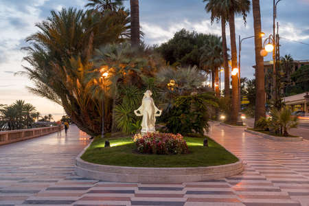 Sanremo, Italy. Promenade of the Empress (Corso Imperatrice) at evening light, alongside the seaの写真素材
