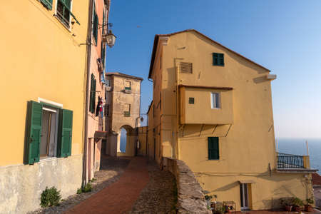 Colourful old-fashioned facÌ§ade the houses in Imperia old town - the city in Liguria region of Italyの写真素材