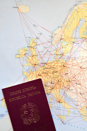 Italian passport with European air route map. Close-up view