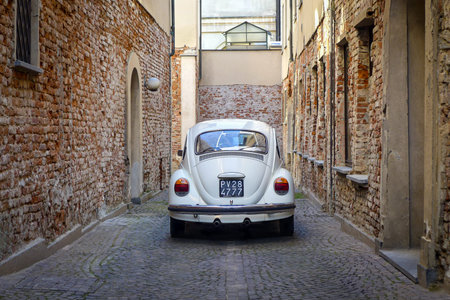 Vigevano, Italy - January 17, 2020: Volkswagen Beetle classic car parked in a street in Vigevano old...