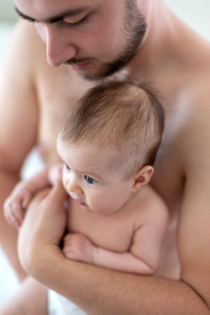 Father holding baby girl (3 months)