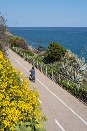 Sanremo, Italy - May 31, 2020: The cycling path into the Riviera dei Fiori coastal park (also called Coastal Park of Western Liguria) is one of the longest in Europe, with a path accessible by pedestrians and cyclists in both directionsのeditorial素材