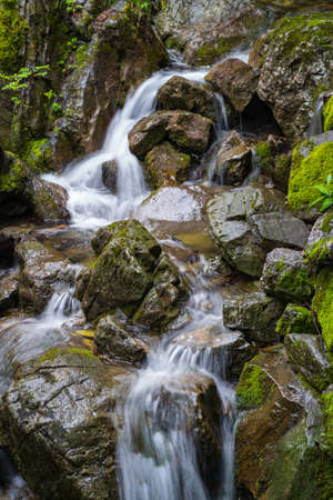 Mountain stream running over rocksの写真素材