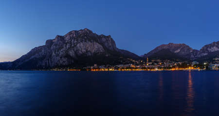 Night view from the lakefront promenade in Lecco on Lake Como, Northern Italyの写真素材