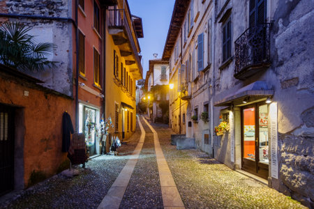 Orta San Giulio, Italy - October 30, 2020: Pedestrian cobbled street of Orta San Giulio old town, Italian Lake District, Piedmont, Italyのeditorial素材