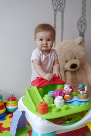 Baby girl playing with toys at homeの写真素材