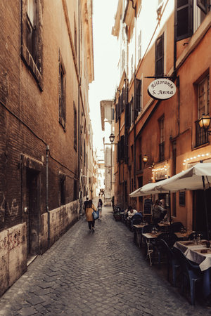 Rome, Italy - June 12, 2021: A narrow ancient alley with cobblestone in the historic center of Romeのeditorial素材