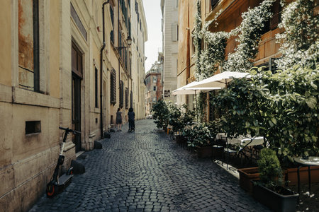 Rome, Italy - June 12, 2021: A narrow ancient alley with cobblestone in the historic center of Romeのeditorial素材