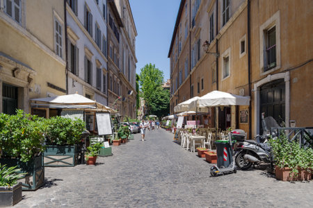 Rome, Italy - June 12, 2021: A narrow ancient alley with cobblestone in the historic center of Romeのeditorial素材