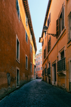 Rome, Italy - June 14, 2021: A narrow ancient alley with cobblestone in the historic center of Romeのeditorial素材