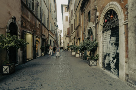 Rome, Italy - June 14, 2021: A narrow ancient alley with cobblestone in the historic center of Romeのeditorial素材