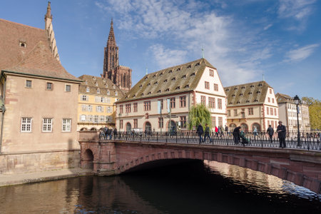 Strasbourg, France - October 25, 2021: Ill River canal with promenade and row of town housesのeditorial素材