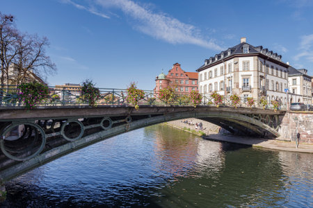 Strasbourg, France - October 25, 2021: Ill River canal with promenade and row of town housesのeditorial素材