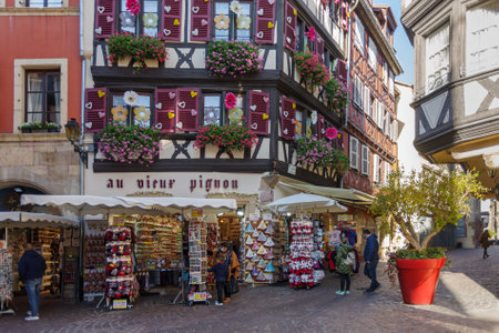 Colmar, France - October 24, 2021: View along pedestrian street in the historic center of Colmar, surrounded well-preserved half-timbered buildingsのeditorial素材