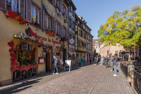 Colmar, France - October 24, 2021: View along pedestrian street in the historic center of Colmar, surrounded well-preserved half-timbered buildingsのeditorial素材