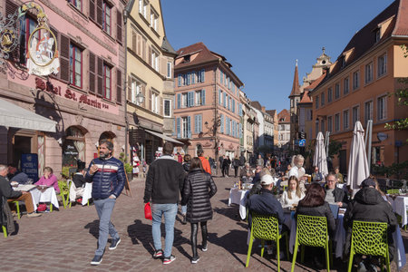 Colmar, France - October 24, 2021: View along pedestrian street in the historic center of Colmar, surrounded well-preserved half-timbered buildingsのeditorial素材