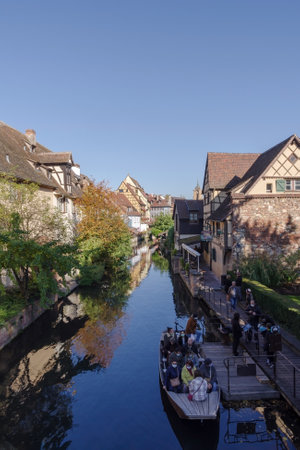 Colmar, France - October 24, 2021: Traditional Alsatian half-timbered houses along the Lauch River in Little Venice tourist district of Colmar, Haut-Rhin department, Grand Est region of Franceのeditorial素材