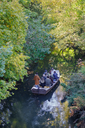Colmar, France - October 24, 2021: Tourists in boat during sightseeing trip along the Lauch River in the district at Little Venice in Colmar, Haut-Rhin department, Grand Est region of northeastern Franceのeditorial素材