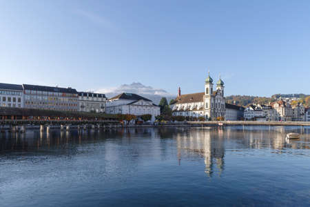 City center of Lucerne, Central Switzerland, Church of St. Francis reflects on Reuss river. Famous landmark of historical cityの写真素材