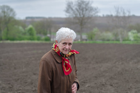 Senior woman standing outdoor in rural settingの写真素材