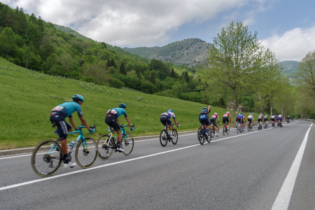 Colle di Nava, Imperia, Italy - May 20, 2022: The peloton passing through mountains landscape of Colle di Nava during the international cycling race 105th Giro d'Italia 2022, Stage 13 a 150km from Sanremo to Cuneo, northwestern Italyのeditorial素材