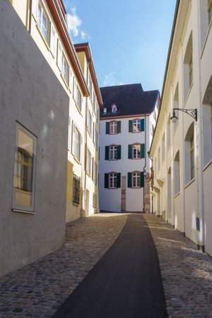 Basel, Switzerland - October 23, 2021: View along street in the center of old town Basel, surrounded...