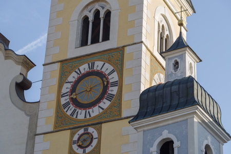 Clock on the bell tower of the Brixen Cathedral, South Tyrol, northern Italyの写真素材
