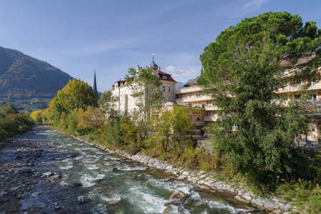 Merano, Italy - October 29, 2022: River Passer flowing along Passer Promenade, Autonomous Province of Bolzano, South Tyrol, Northern Italyの写真素材