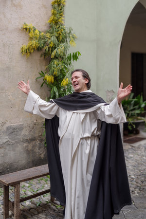 Taggia, Italy - February 26, 2023: Participant of historical reenactment in the old town of Taggia, in Liguria region of Italy. The actors acting out episodes of daily life in settings that evoke moments of life lived fully the seventeenth century. The epのeditorial素材
