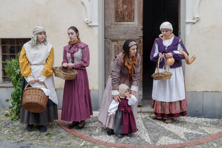 Taggia, Italy - February 26, 2023: Participants of historical reenactment in the old town of Taggia, in Liguria region of Italy. The actors acting out episodes of daily life in settings that evoke moments of life lived fully the seventeenth century. The eのeditorial素材
