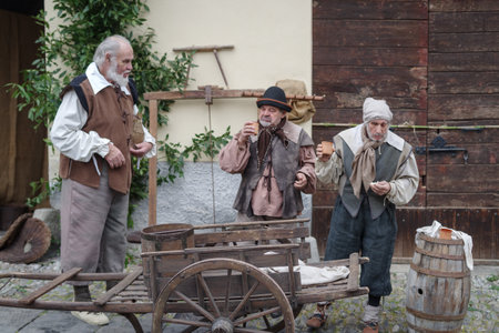 Taggia, Italy - February 26, 2023: Participants of historical reenactment in the old town of Taggia, in Liguria region of Italy. The actors acting out episodes of daily life in settings that evoke moments of life lived fully the seventeenth century. The eのeditorial素材