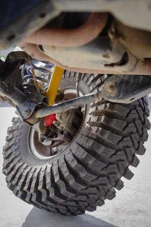 Close-up of trim and all terrain tire on off-road vehicle